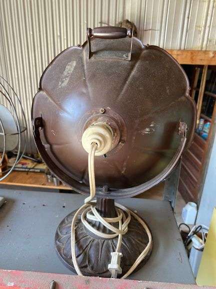 Antique electric heater w/ copper reflector, on cast iron base