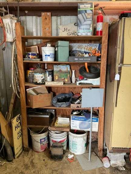 Contents of shelf unit: fire extinguisher, costume jewelry, motor, misc