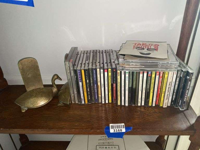 Brass bird bookends, and classical music CDs