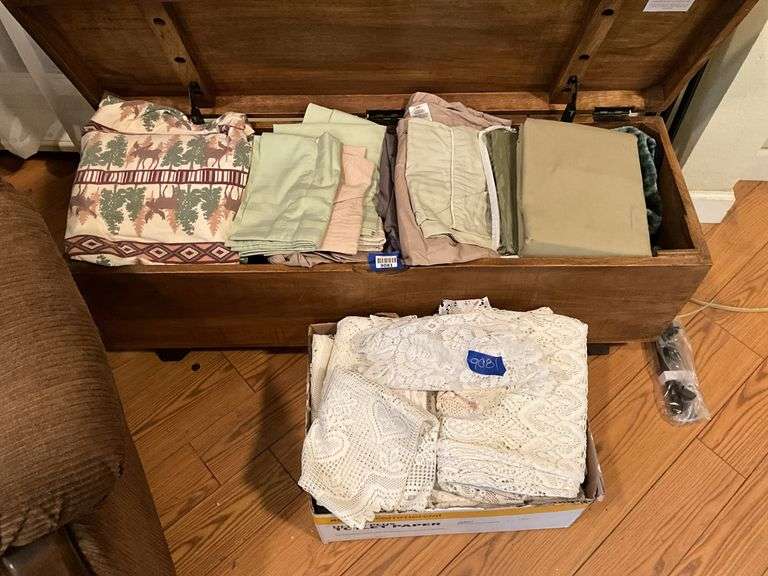 Contents of chest: lace and linens