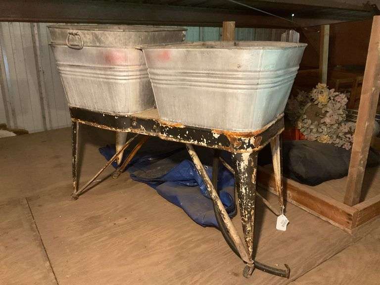 Double washtub on rolling metal base, w/ extra tub, *** PLEASE NOTE: This item has no stair access and must be picked up on July 15th between 11:00-1:30PM. Item will be removed from loft for pickup.