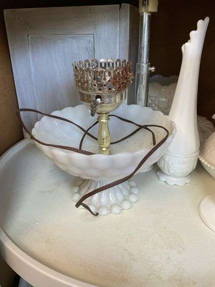 Contents of shelf: milk glass hen on nest, swung vase, compote, butter dish, grape vase, lamp base