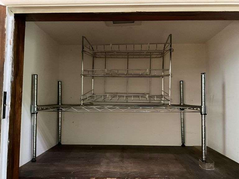 Contents of closet: hand weights, wire shelving, luggage, bags, misc