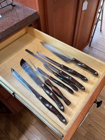 Contents of drawer: Cutco kitchen knives and carving fork