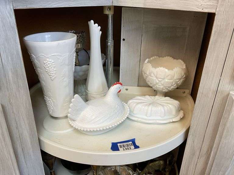 Contents of shelf: milk glass hen on nest, swung vase, compote, butter dish, grape vase, lamp base