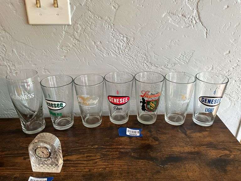 Seven advertising beer glasses