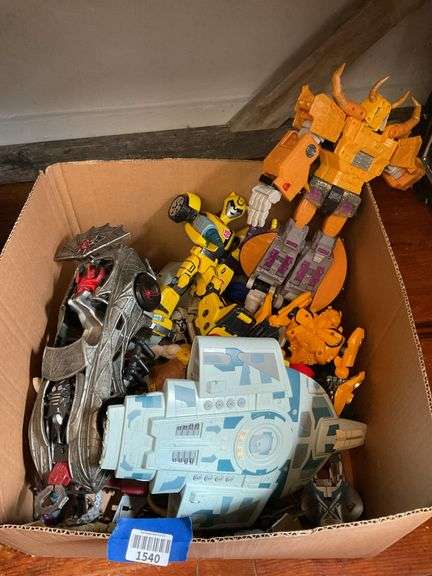 Toy lot including: Spider-Man car, WWE Sin Cara action figure, Transformers, misc