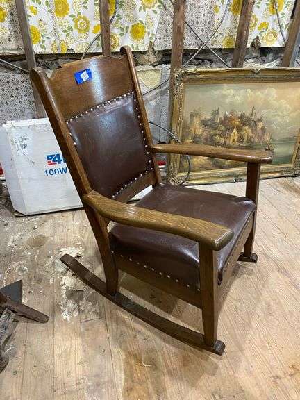 Turn-of-the-century oak rocking chair w/ upholstered seat and back panel