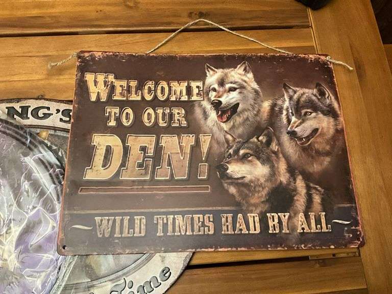 Three metal wolf plaques