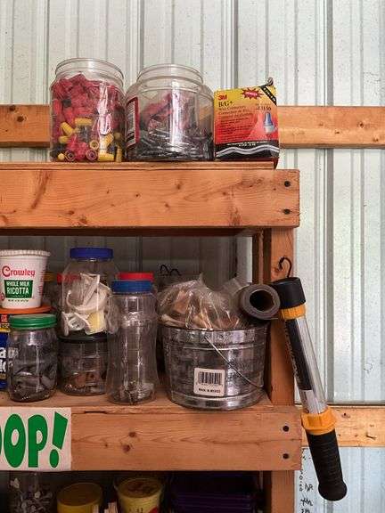 Contents of two shelves: hardware, trouble light