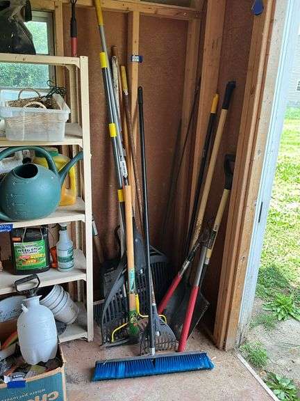 Corner lot: push broom, pick, rakes, lopper, shovel