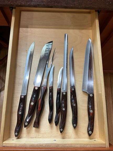 Contents of drawer: Cutco kitchen knives and carving fork