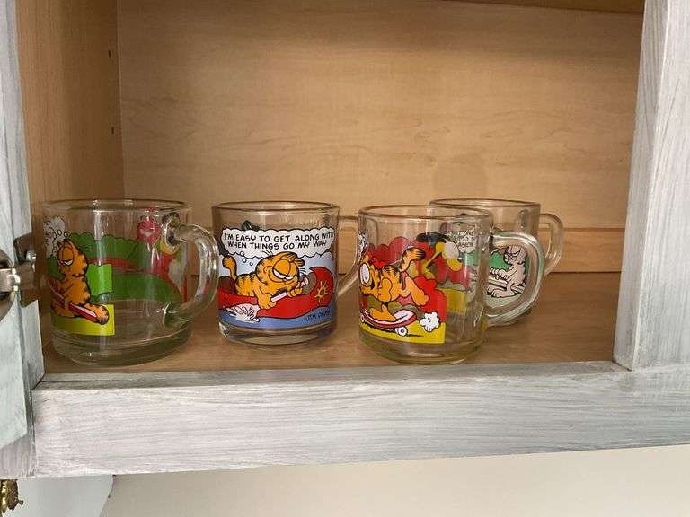 Four Garfield glass mugs