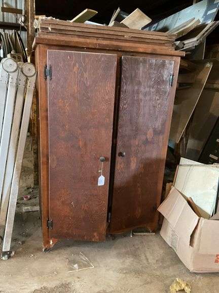 2-door wooden wardrobe cupboard 57 x 38 x 25, *** PLEASE NOTE: This item has no stair access and must be picked up on July 15th between 11:00-1:30PM. Item will be removed from loft for pickup.