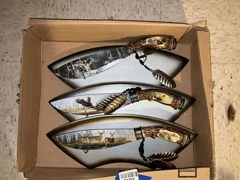 Three decorated wildlife knives/plaques