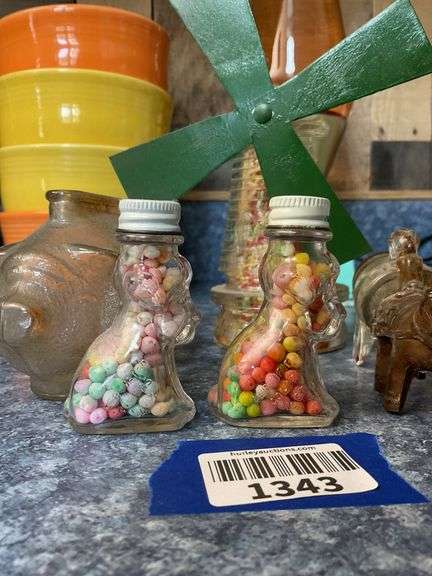 Glass piggy bank and four figural glass candy containers - note damage to barrel wagon