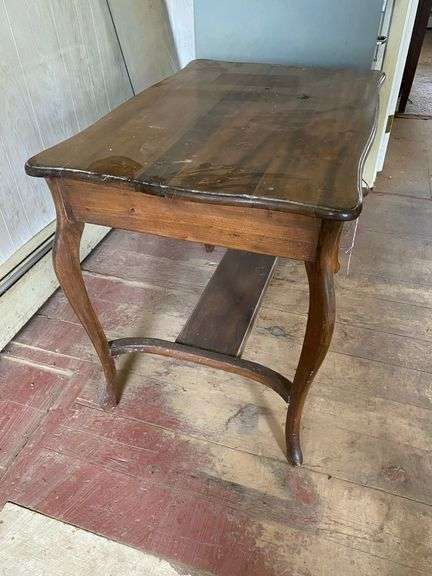 Turn-of-the-century library table w/ drawer in apron, sawn cabriole legs. Contents of drawer included  36x24x29
