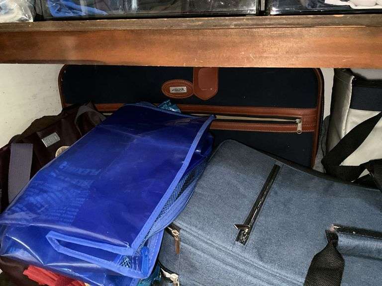 Contents of closet: hand weights, wire shelving, luggage, bags, misc
