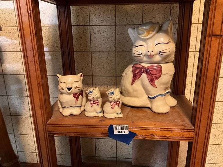 Contents of shelf: Shawnee Puss-in-Boots cookie jar, creamer, and salt/pepper shakers