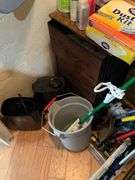Contents of closet: MooSoo vacuum, Hoover upright vacuum, hand vac, cleaning supplies, Swiffer and refills, drawer unit, metal shelf unit, hangers, misc