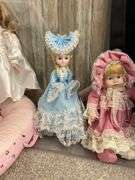 Four porcelain collector dolls