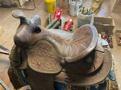 Fancy tooled leather saddle, saddle blanket,  and stand