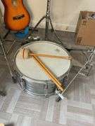 Snare drum, hi-hat cymbal, First Act guitar, two stools