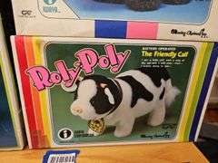 Wind-up and battery op toys in boxes including: Mother Goose, dog, pig, bears, calf