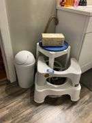 Stool, toilet stools, waste can, blood pressure monitor in box, contents of cabinet under sink and drawer