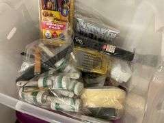 Contents of bathroom: iron, ironing board, rolling stand, waste basket, craft supplies, lightbubls