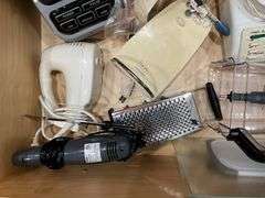 Contents of drawer: blenders, electric knife, hand mixer, grater
