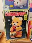 Wind-up and battery op toys in boxes including: Mother Goose, dog, pig, bears, calf