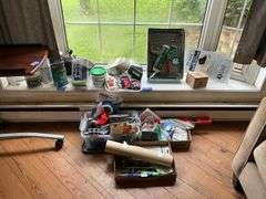 Floor lot and contents of windowsill: level, hand tools, painting supplies, laser level, misc