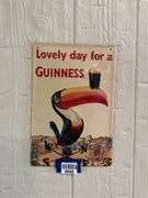 Guinness embossed tin advertising sign
