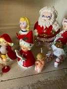 Contents of shelf: vintage china Santa and other Christmas figurines