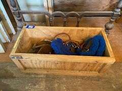 Horse tack in wooden crate