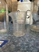 Eastman-Kodak graduated measure and vintage bottles