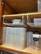Contents of two shelves: plastic storage containers