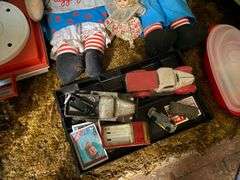 Vintage riding horse and contents of closet: baby scale, toy rifles, child's turntable, Raggedy Ann & Andy dolls, toy cars, misc toys