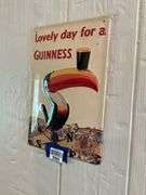 Guinness embossed tin advertising sign