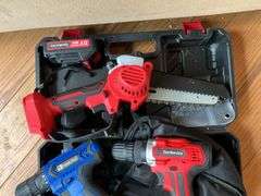 Cordless tool kit: two drills, mini chainsaw, charger
