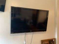 LG wall mounted TV model: 47LD520 w/ remotes, bring tools to remove.