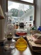 Three glass oil lamps w/ burners and chimneys