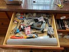 Contents of four drawers: gadgets, household items, measuring cups, power strip, misc