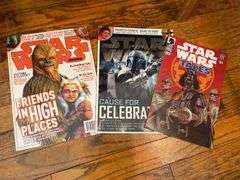 Star Wars collectibles including: VHS tapes, figures, CommTech reader, Darth Vader watch