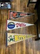 Six pennants: Buffalo Bills (autographed), Forty-Niners, Jets, Bengals, Notre dame, Aloha bowl