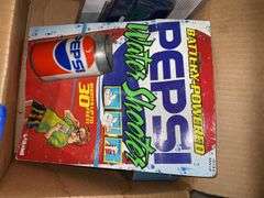 Pepsi collectibles: Santa sign, radio/cassette player, water shooter, trading cards