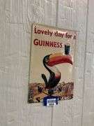 Guinness embossed tin advertising sign