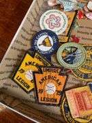 Patches including: Navy Seaman Apprentice, advertising, school letters