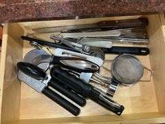 Contents of drawer: flatware, utensils